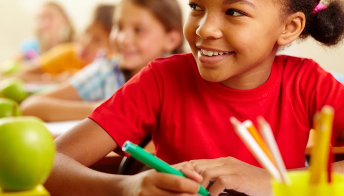 close-up-smiling-student-with-classmates-background (1)
