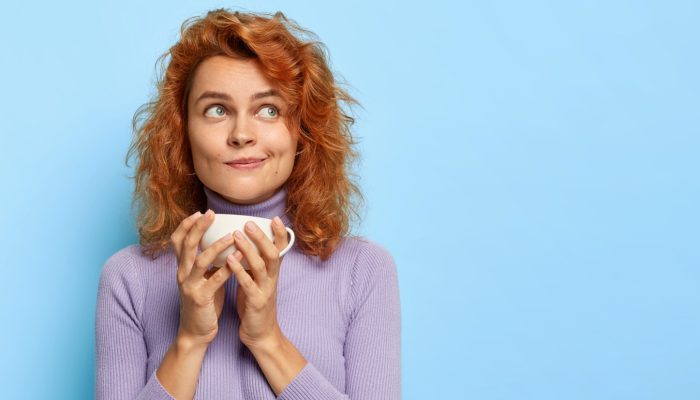 coffee-break-concept-beautiful-thoughtful-redhead-woman-holds-mug-espresso