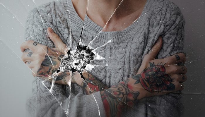 cracked-glass-effect-with-depressed-woman-background