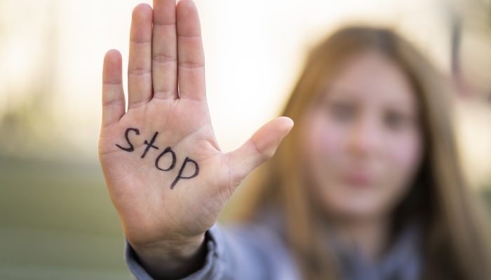 defocused-person-protesting-with-writing-hand-world-environment-day-outdoors
