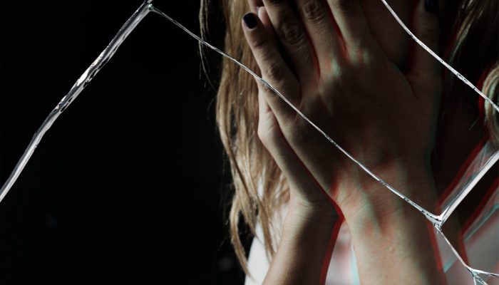 depressed-woman-with-cracked-glass-effect