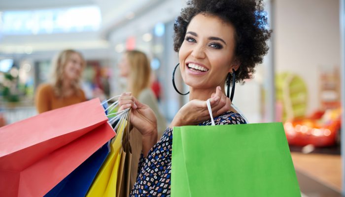 happy-woman-with-full-shopping-bags