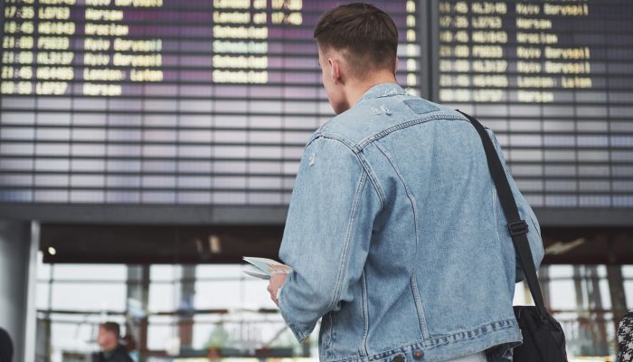 The man expects his flight at the airport