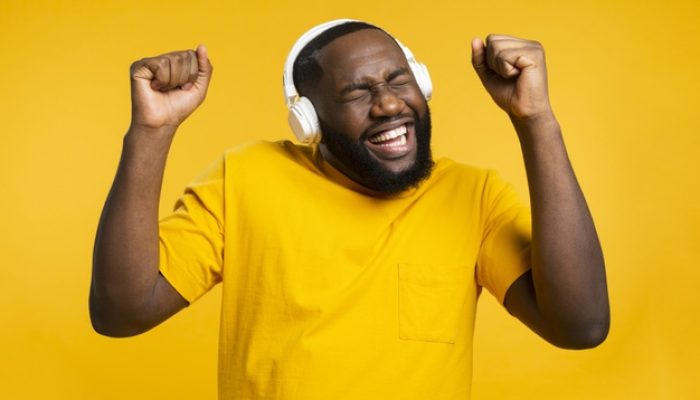 man-with-headphones-dancing_23-2148467239