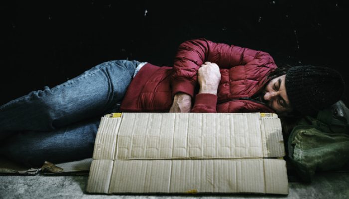 Homeless man sleeping on the street