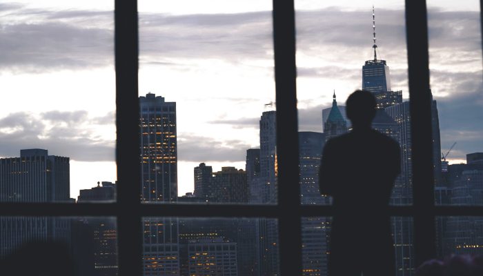 silhouette-successful-male-standing-window-overlooking-island-manhattan.jpg1