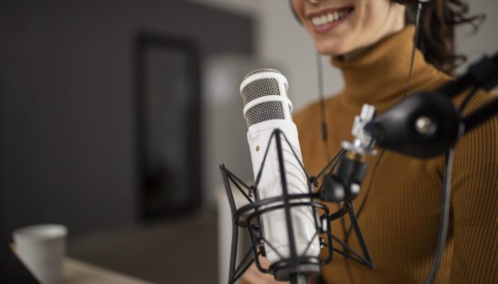 woman-broadcasting-radio-while-smiling