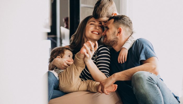 young-family-with-their-sons-home-having-fun