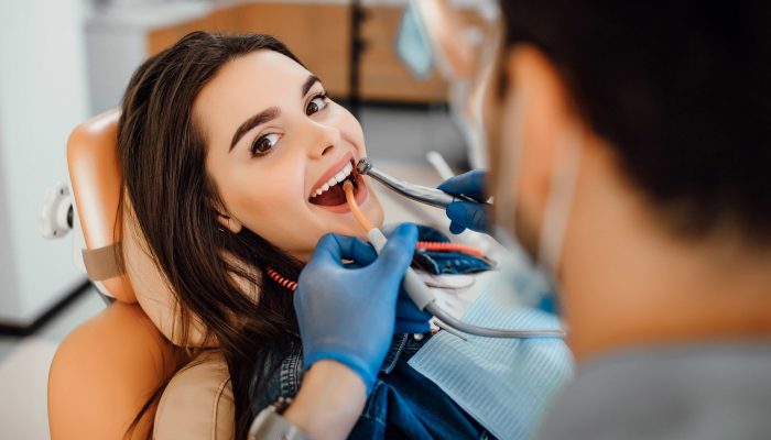 young-female-patient-visiting-dentist-office